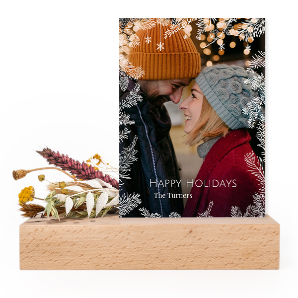 Forex card in wooden stand with dried flowers