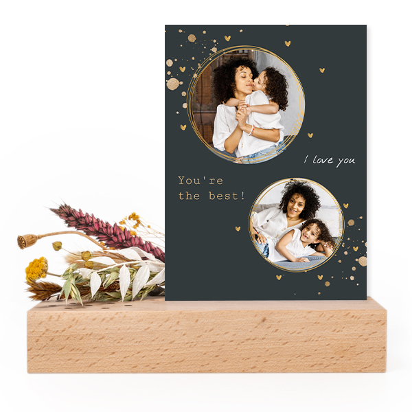 Forex card in wooden stand with dried flowers