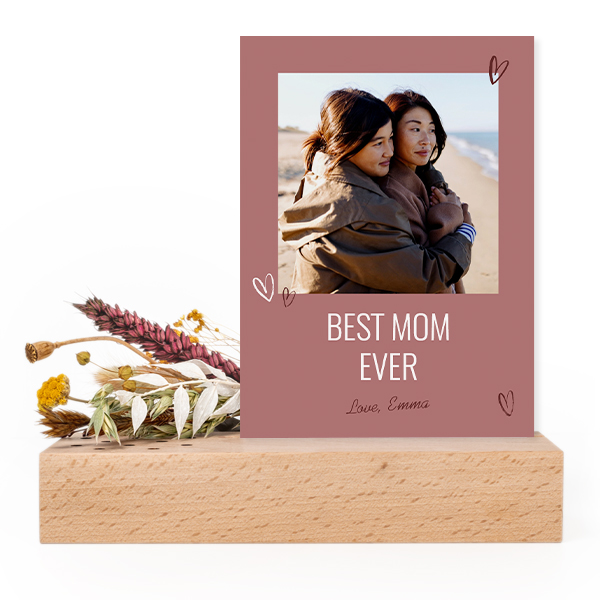 Forex card in wooden stand with dried flowers