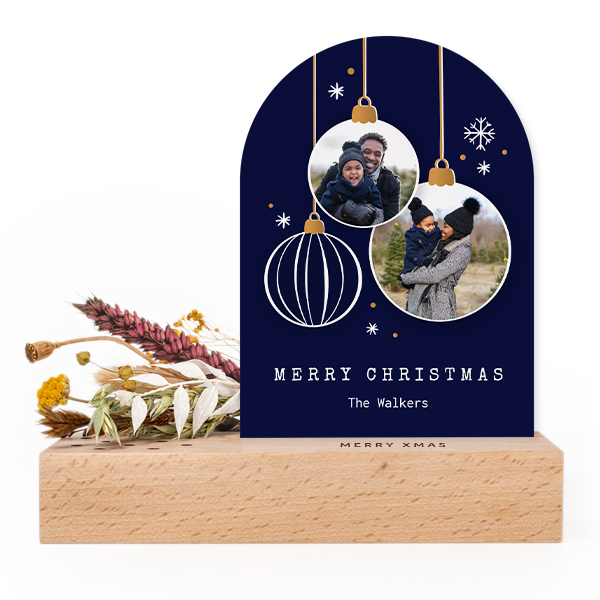 Wooden block with print, dried flowers and arched forex card