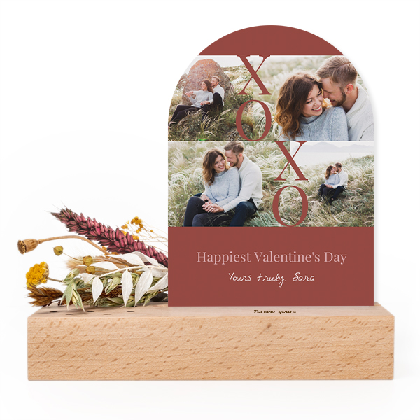 Wooden block with print, dried flowers and arched forex card