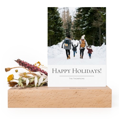 Wooden block with print, dried flowers and forex card