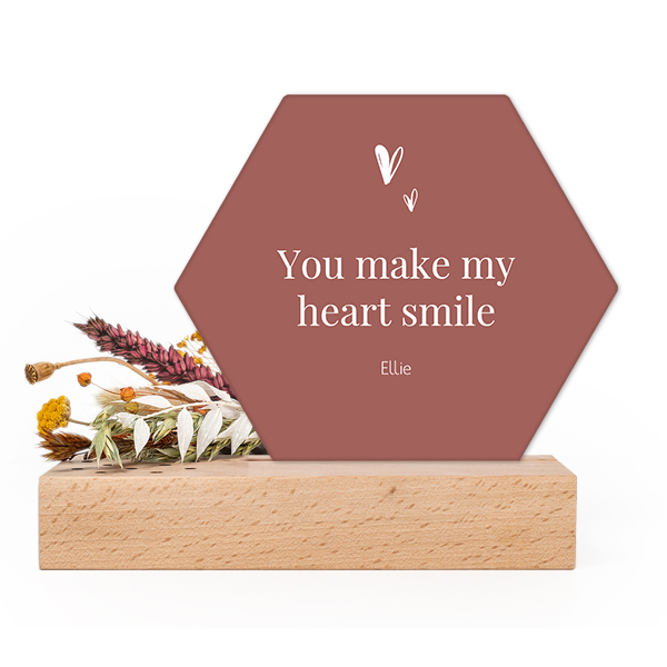 Wooden block with dried flowers and hexagonal forex card