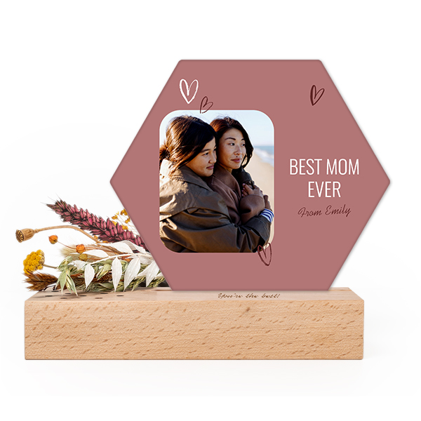 Wooden block with print, dried flowers and hexagonal forex card