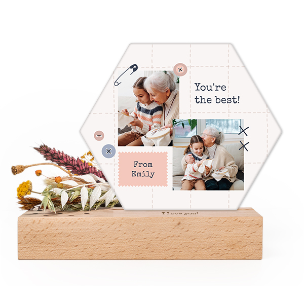Wooden block with print, dried flowers and hexagonal forex card