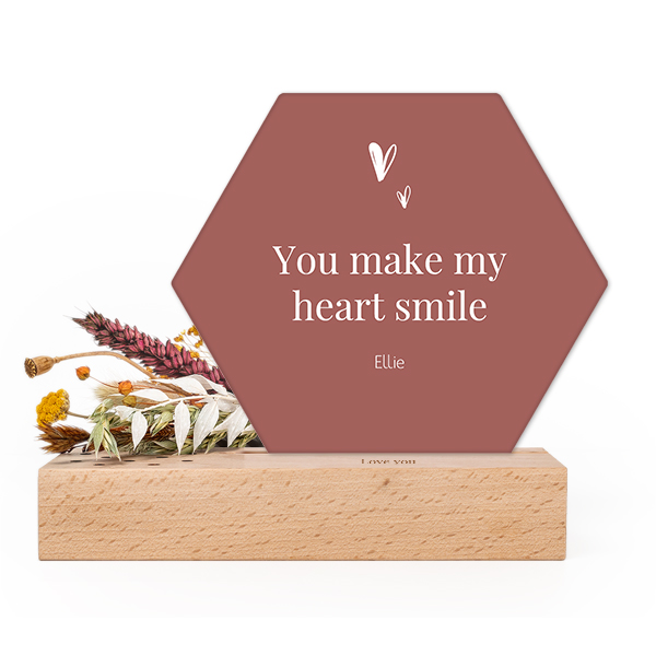 Wooden block with print, dried flowers and hexagonal forex card