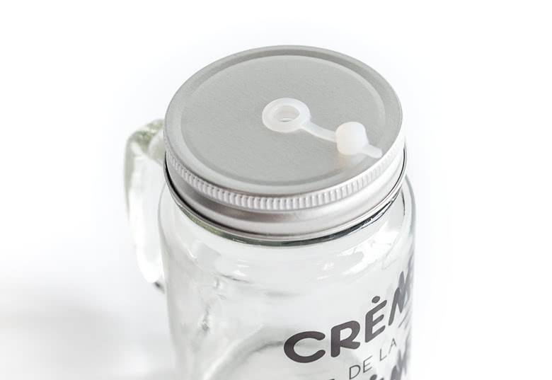 Glass drinking jar with lid and straw