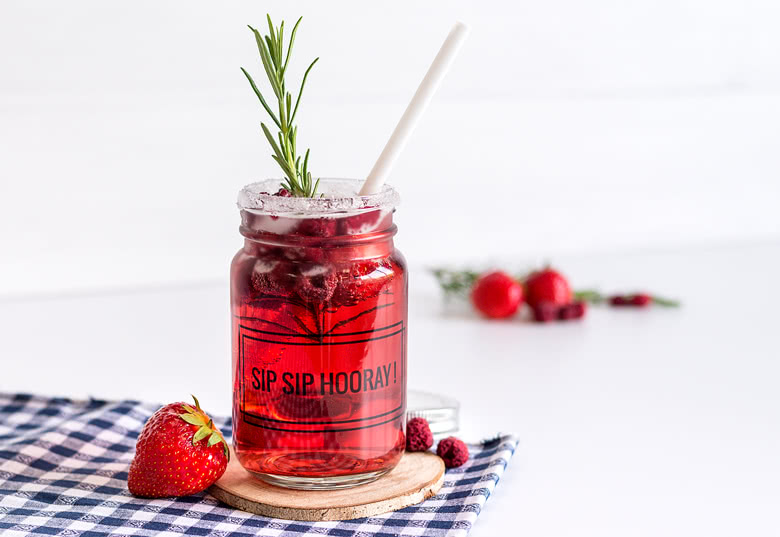 Glass drinking jar with lid and straw