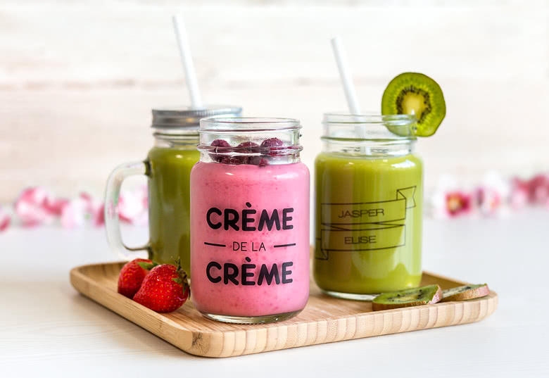 Glass drinking jar with lid and straw