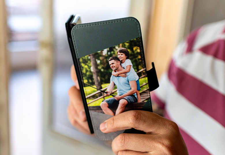 Black Samsung wallet case with a personalised photo of a father and his son on the cover.