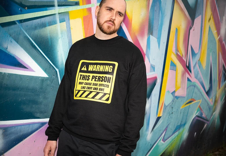 Grey personalised sweatshirt with a sunflower design and 'Plant Mom' text on the chest.