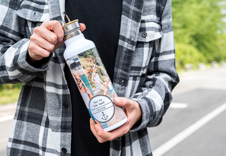 Personalised thermos bottle with a collage of holiday photos and the text "You're the best" and "Oliver" on a white background.