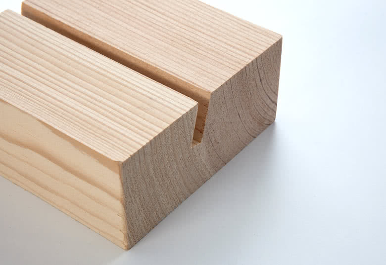 Polished wooden block with incision that fits 13 photo cards