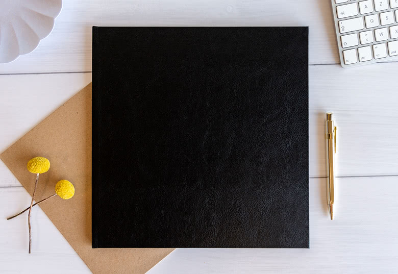 Fotoboek XL vierkant fotopapier zwart lederen kaft platliggende binding